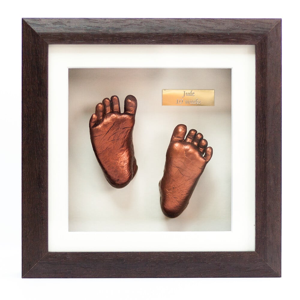 Bronze baby feet casting displayed in decorative frame - Casting Impressions Surrey