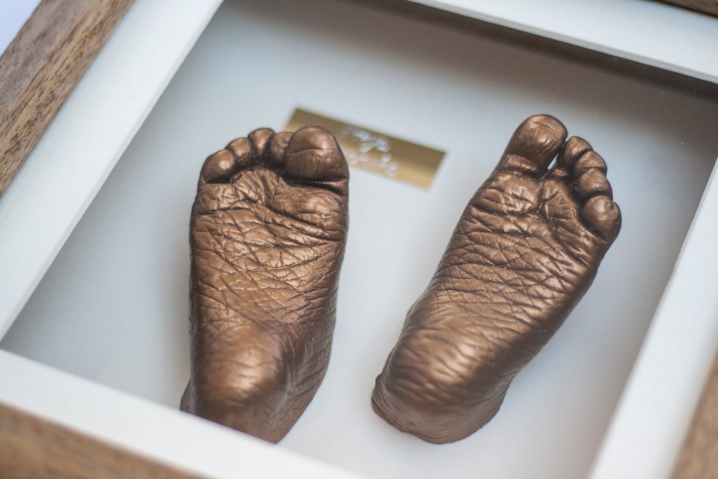 Bronze baby hands casting preserved in beautiful frame - professional casting