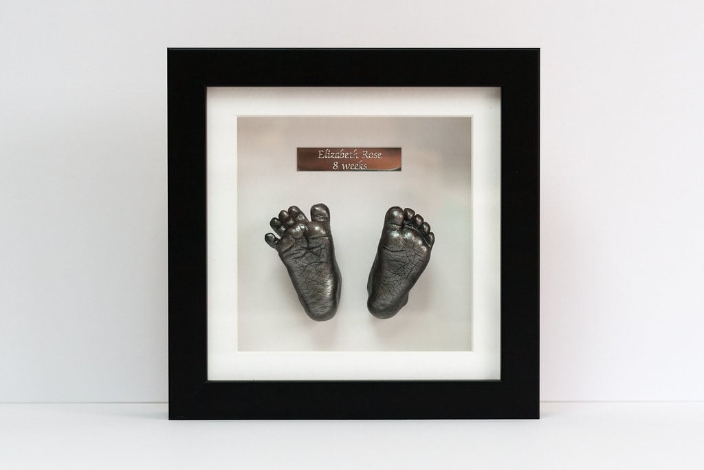 Bronze baby foot casting in 8x10 frame - professional 3D casting specialist Surrey