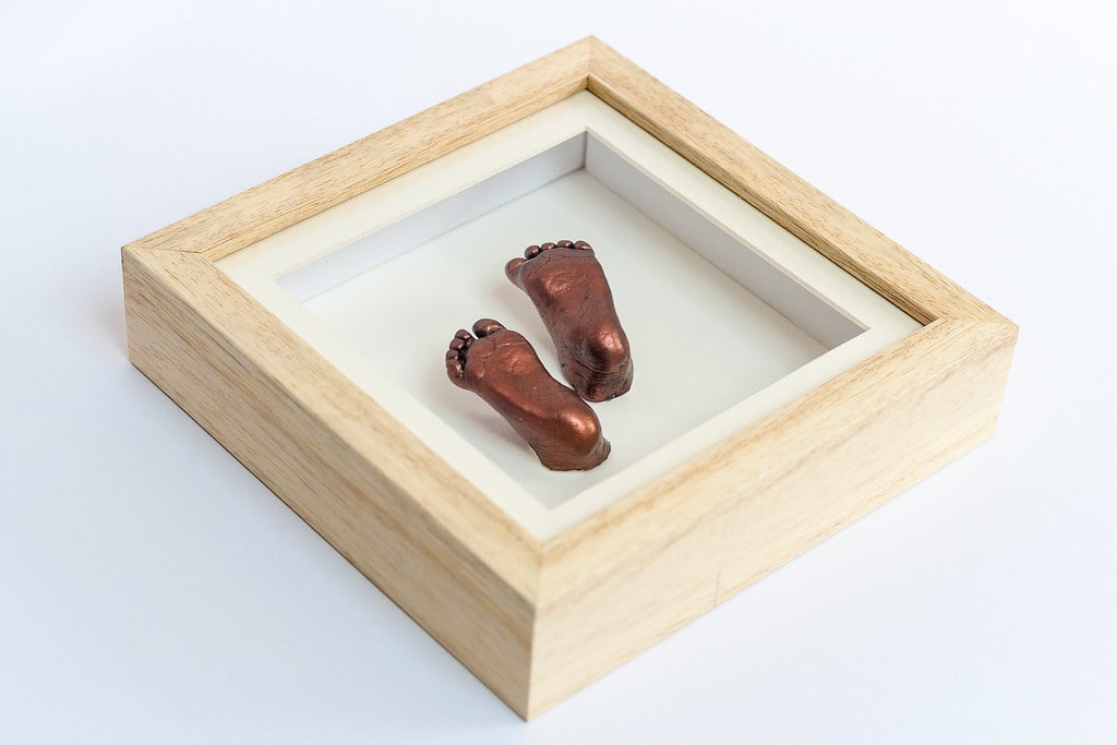 Gold baby foot casting in decorative frame with name plate - life casting