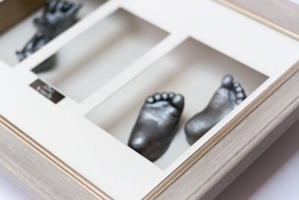 Silver baby hands casting in elegant decorative frame - 3D life casting service