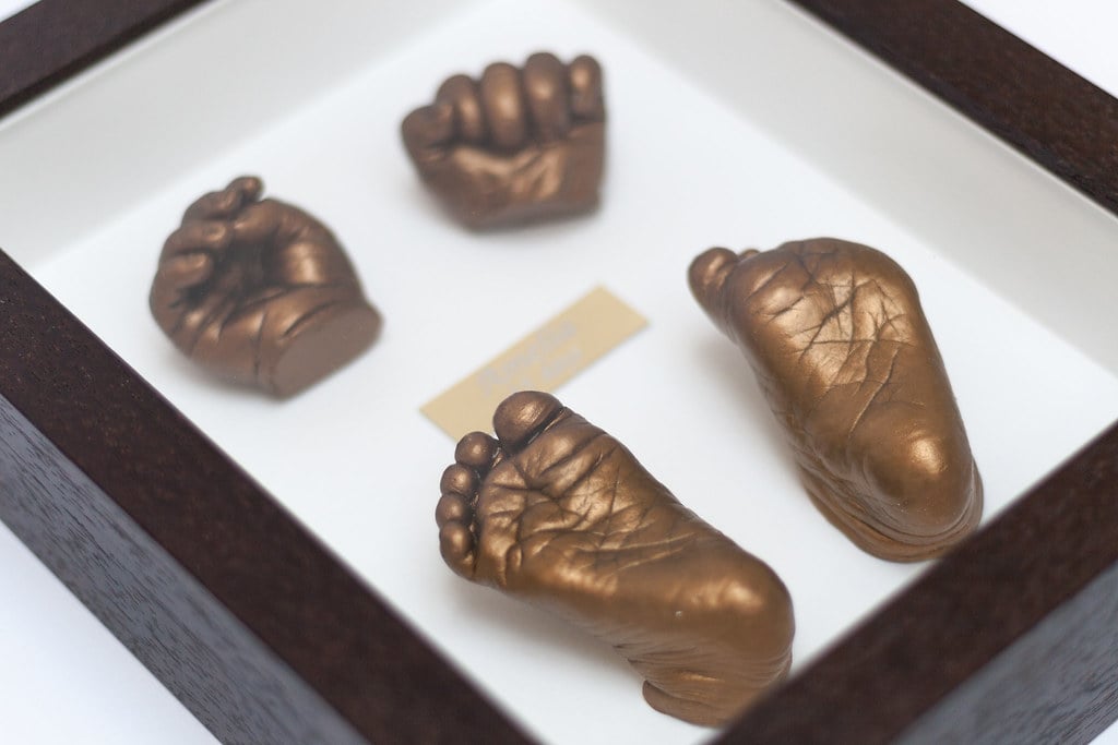 Gold baby feet casting in frame with name plate - baby casting keepsake Surrey