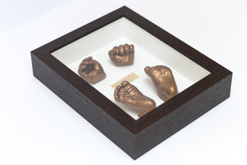 Bronze baby hand casting preserved in 8x10 frame - professional 3D casting