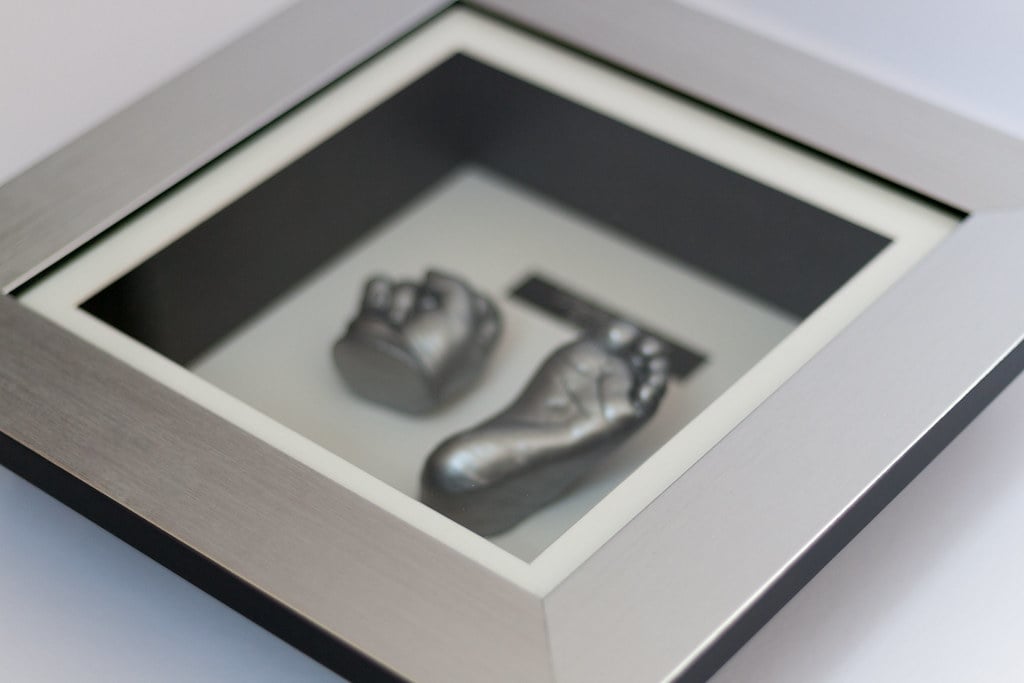 Silver baby hand and foot casting displayed in beautiful frame - life casting