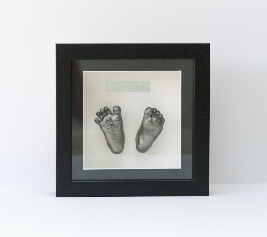 Bronze baby feet casting displayed in decorative frame - Casting Impressions Surrey