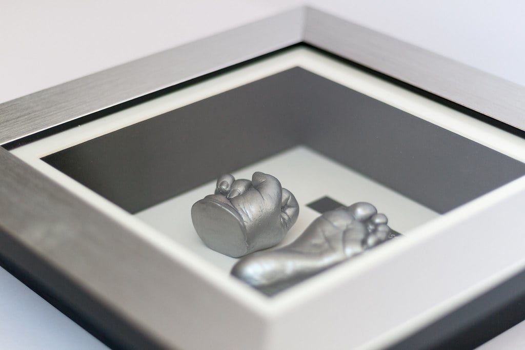Gold baby foot casting preserved in beautiful frame - 3D casting service