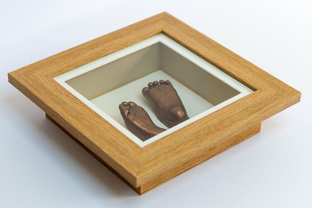 Silver baby hands casting displayed in 8x10 frame - baby casting keepsake