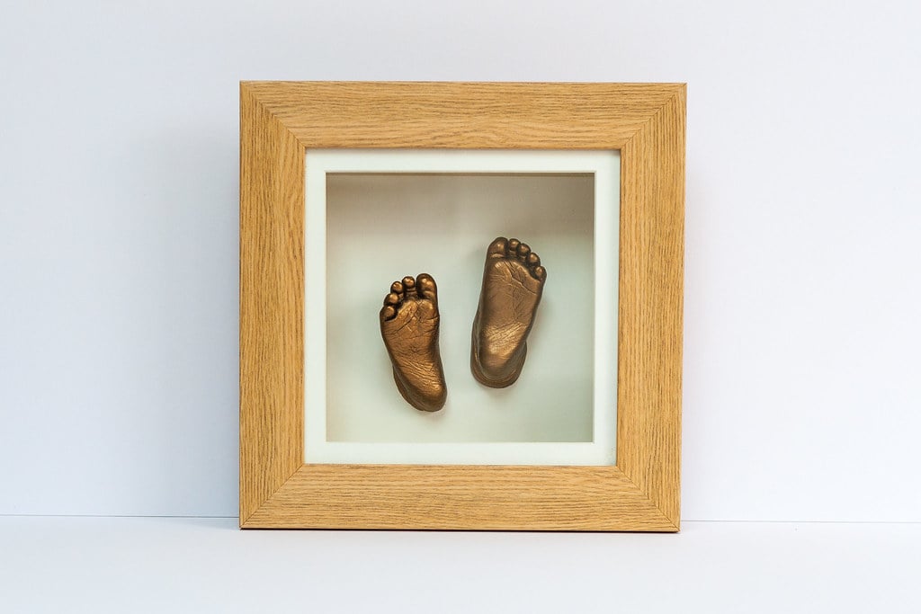 Bronze baby hand and foot casting in elegant frame - Guildford casting