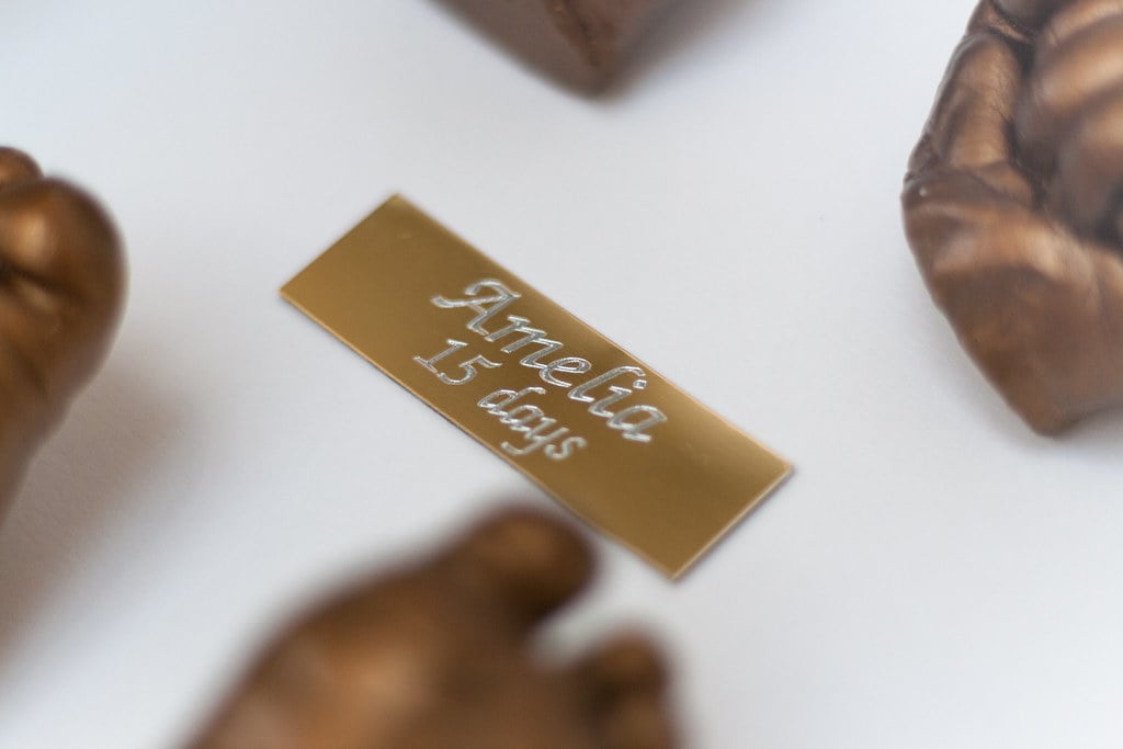 Bronze baby foot casting in 8x8 frame - professional casting service Woking