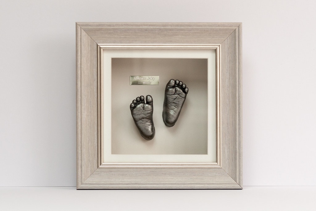 Silver baby foot casting in elegant frame