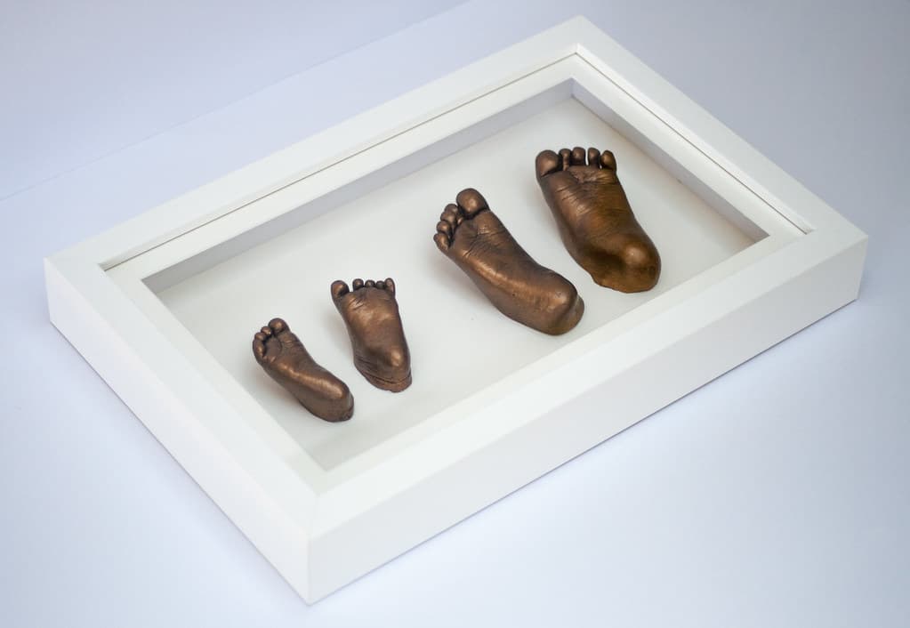 Bronze baby hand casting in an elegant frame