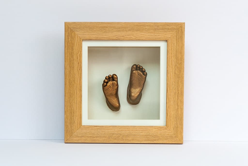 Bronze baby hand and foot castings in one frame